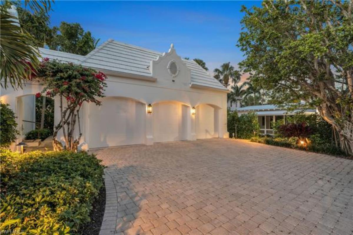 Garage with a spacious driveway.