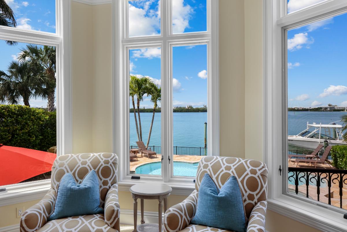 Sitting area with chairs and glass windows.