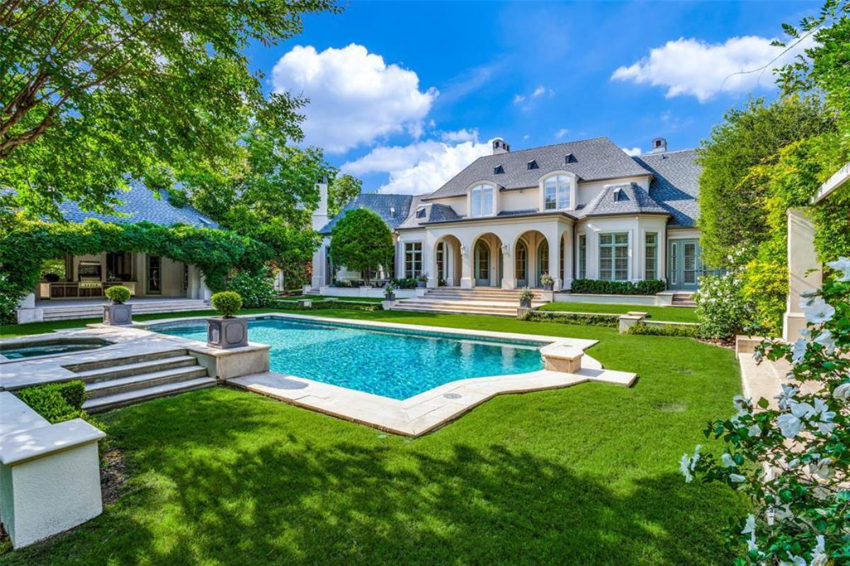 Rear view of the mansion with a pool.