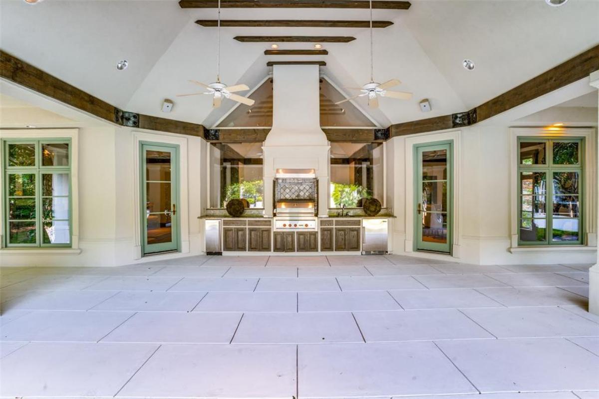 Covered patio with a grill area.