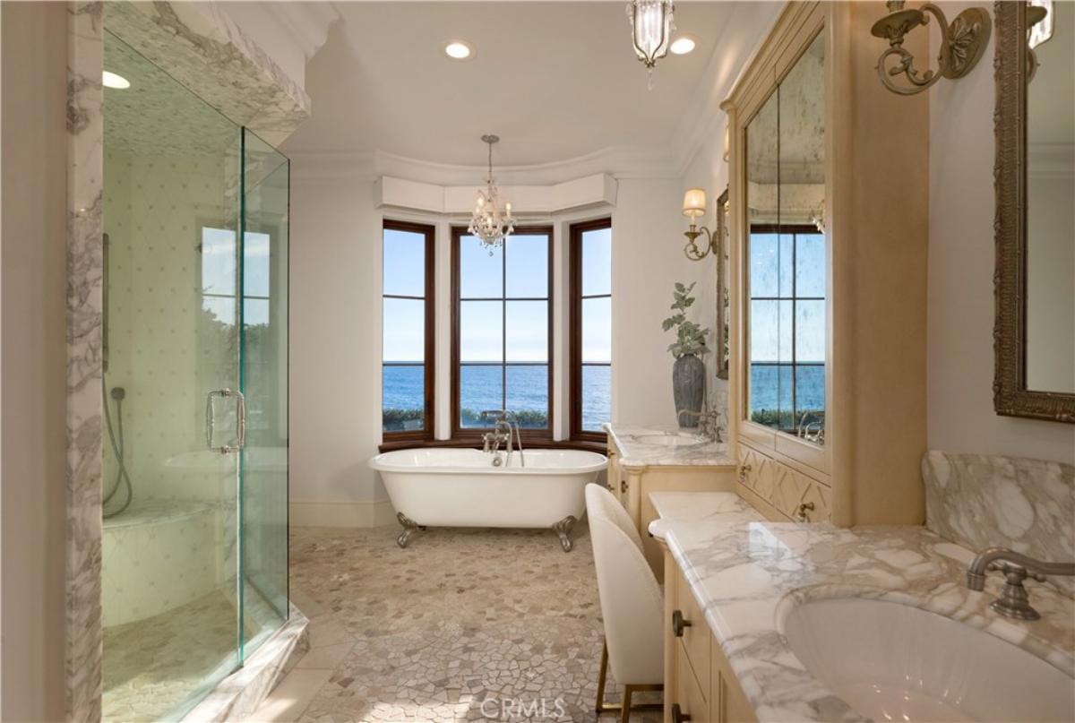 Bathroom with a sink, soaking tub and a walk-in shower.