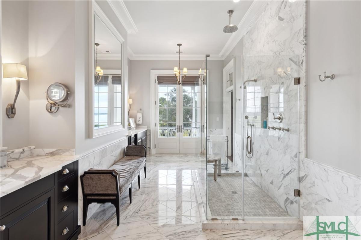 Bathroom with sinks and a walk-in shower.