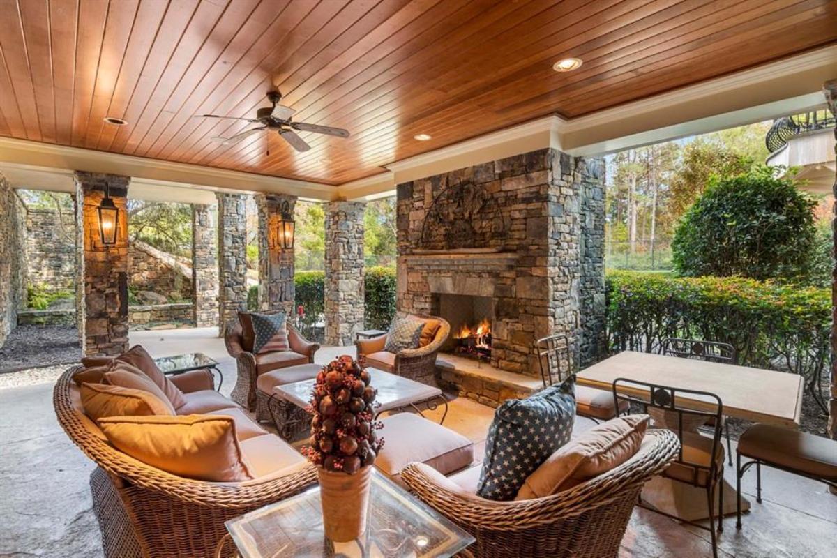 Covered patio with a fireplace.