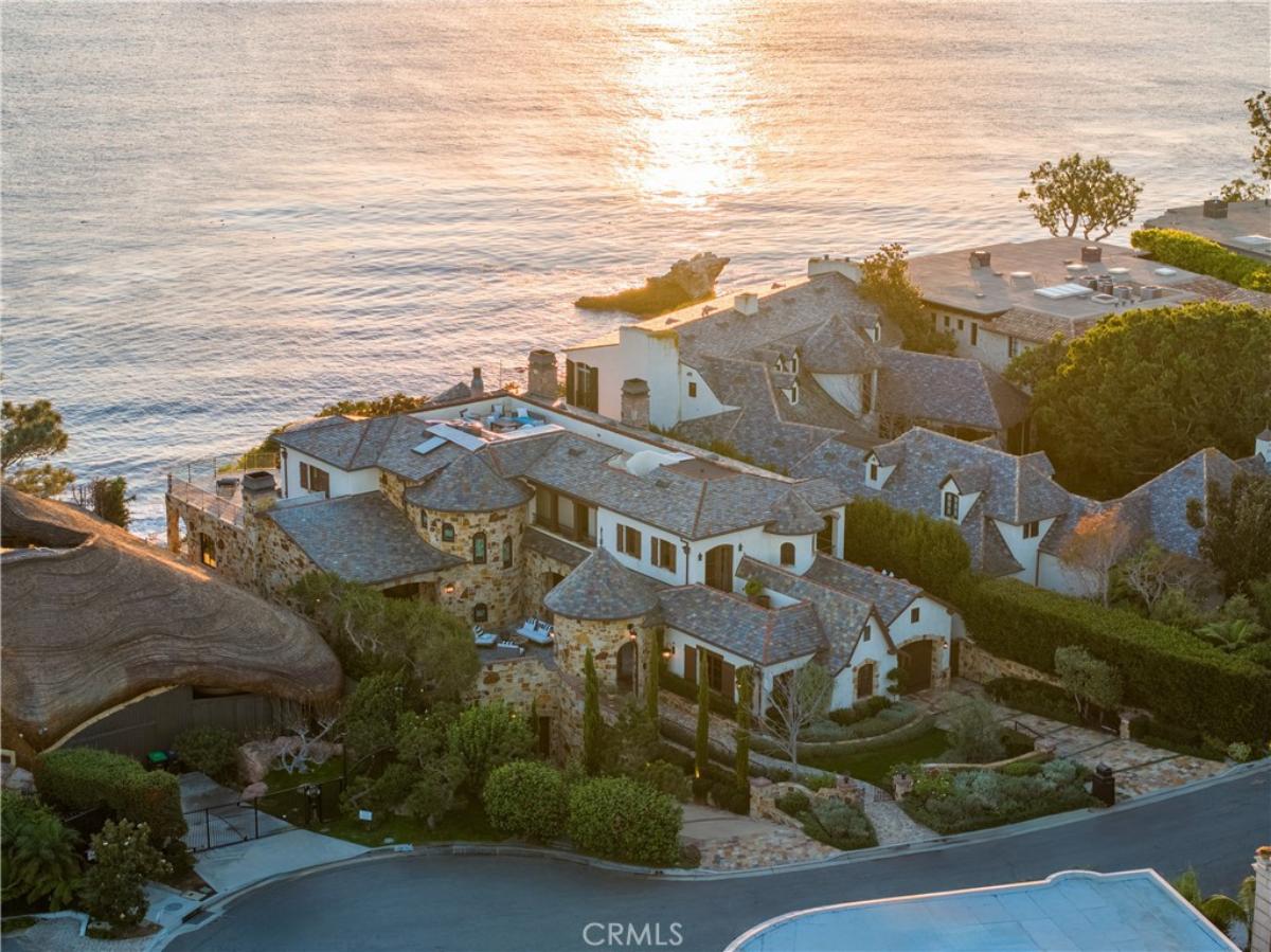 Aerial view of the property with a view of the ocean.