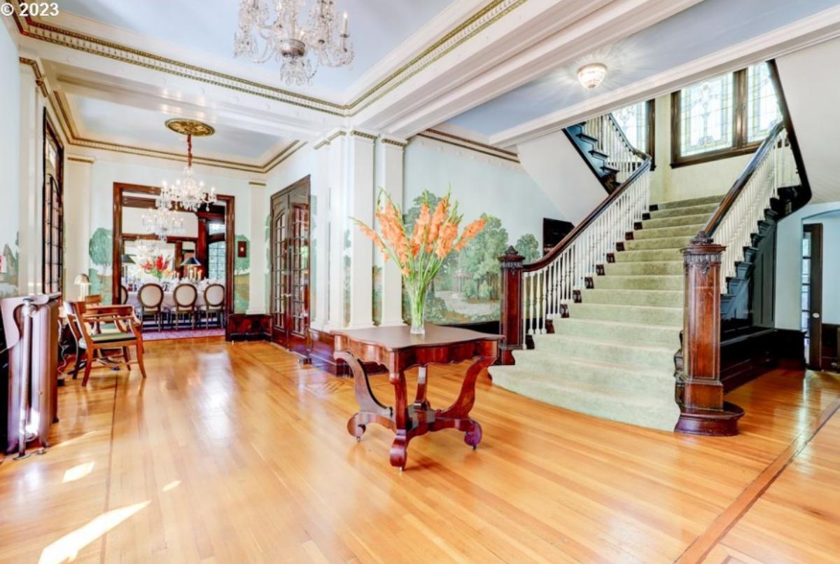 Foyer with a chandelier and a staircase.
