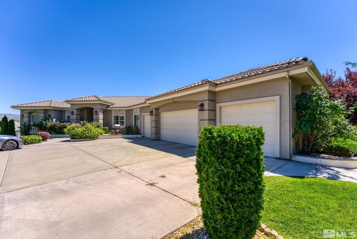 Garage with a spacious driveway.