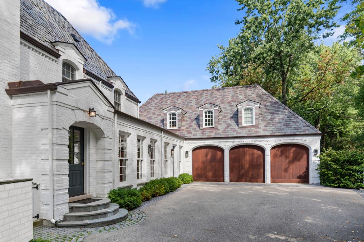 Garage with a spacious driveway.