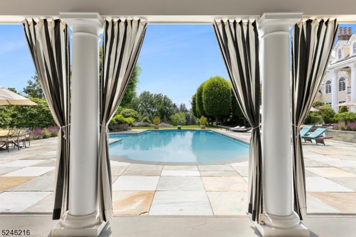 Pool with lounge chairs.