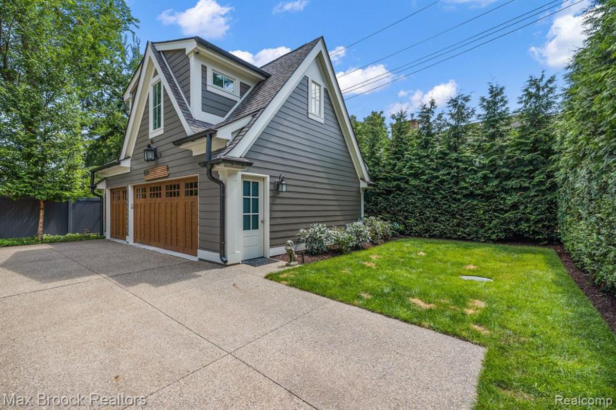 Garage with a large driveway.