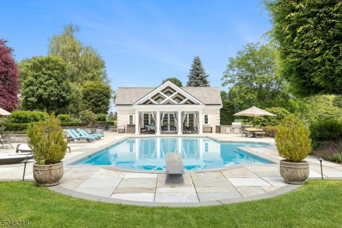 Pool with lounge chairs.