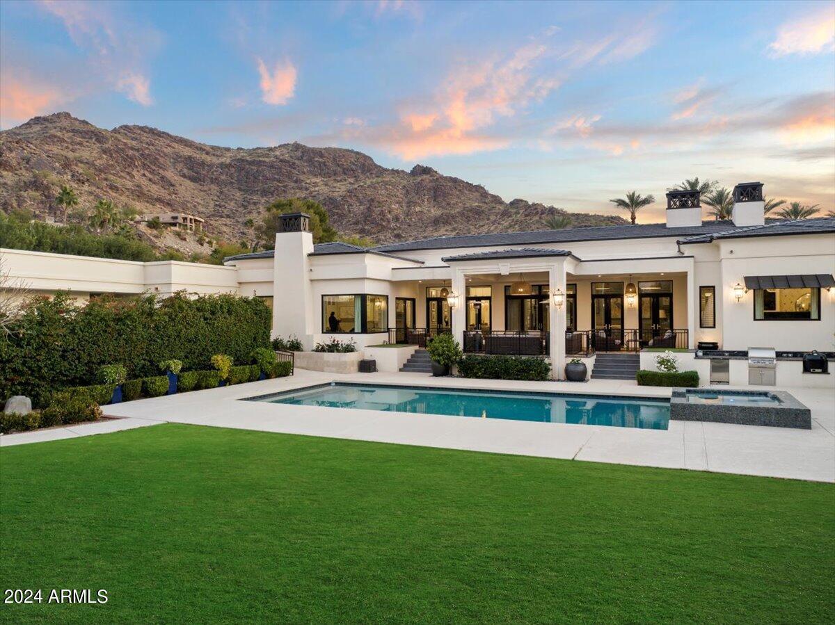 Rear view of the house with a pool.