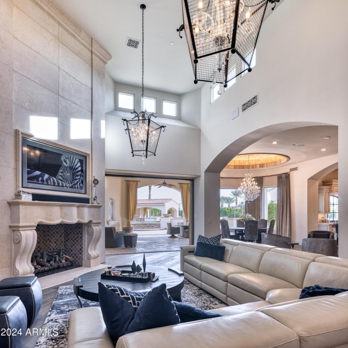 Living room with couches. fireplace and a large rug.
