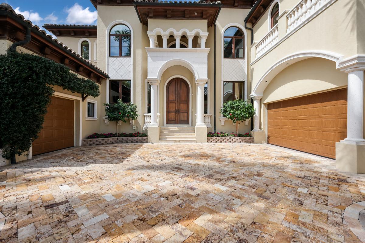 Garage with a spacious driveway.