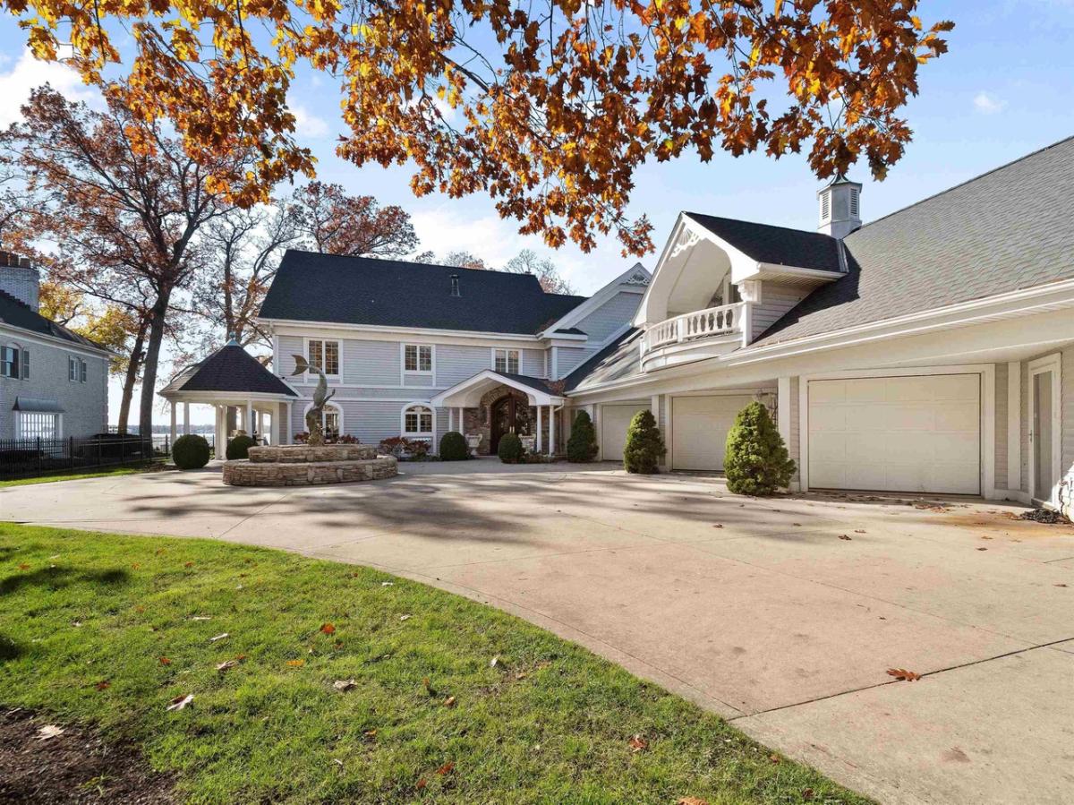 Exterior view of the mansion with 4 garage spaces.
