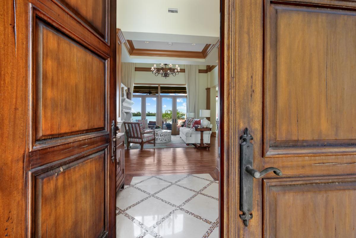 Front entry with wooden doors.