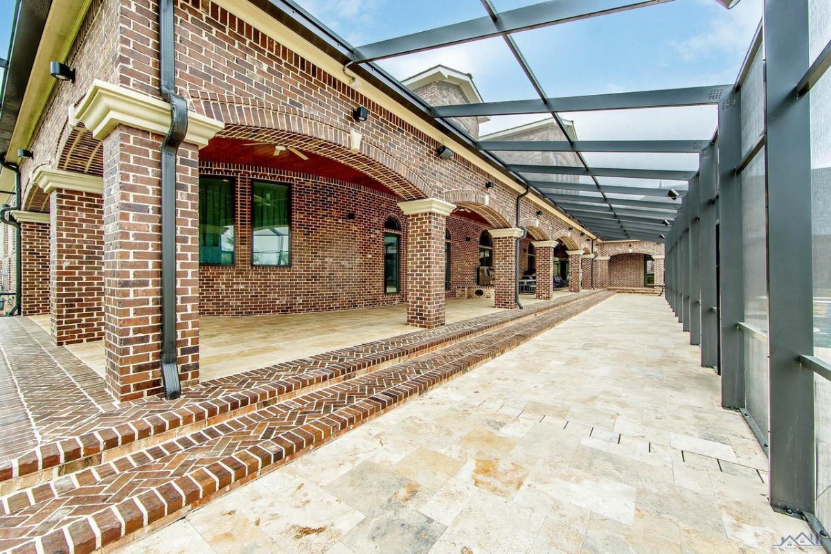 Rear view of the property with a glass roof.