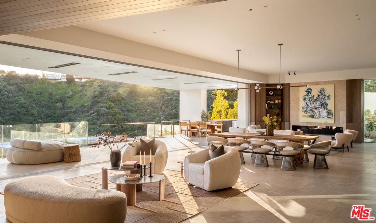 Living room with a table and couches.