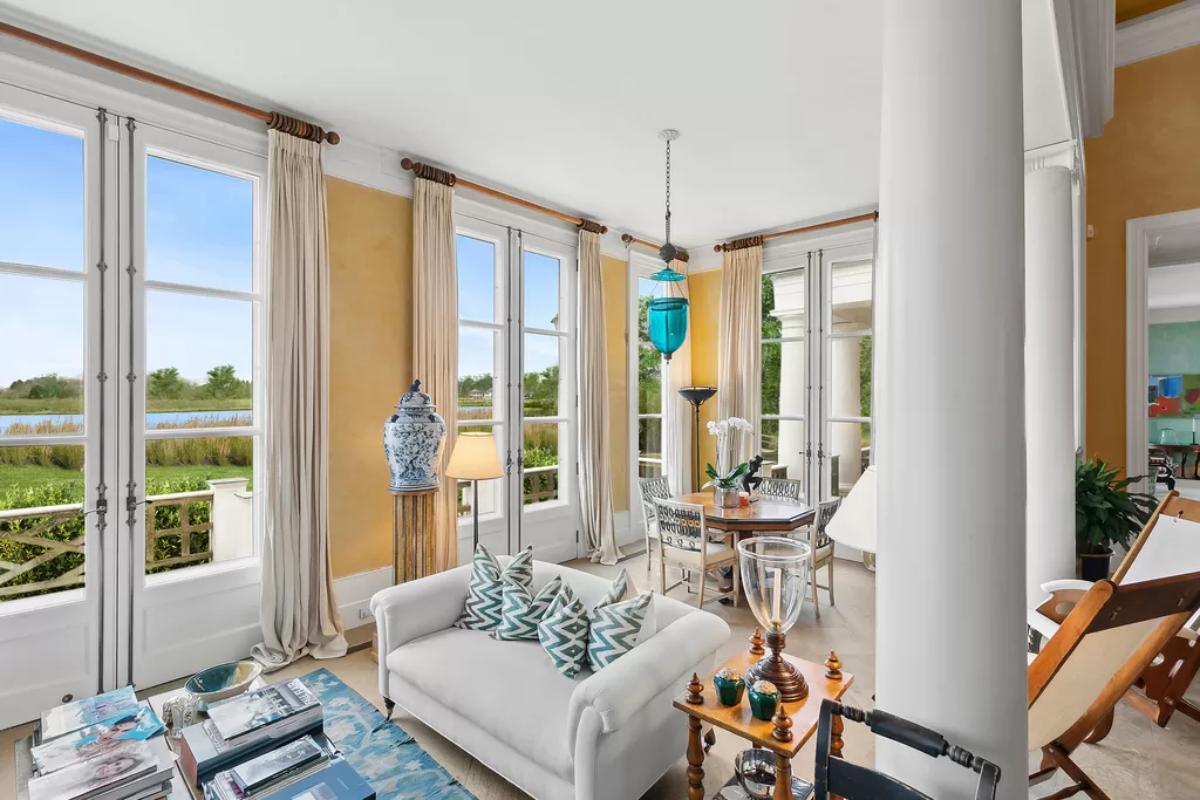 Sitting area with a couch and glass doors.