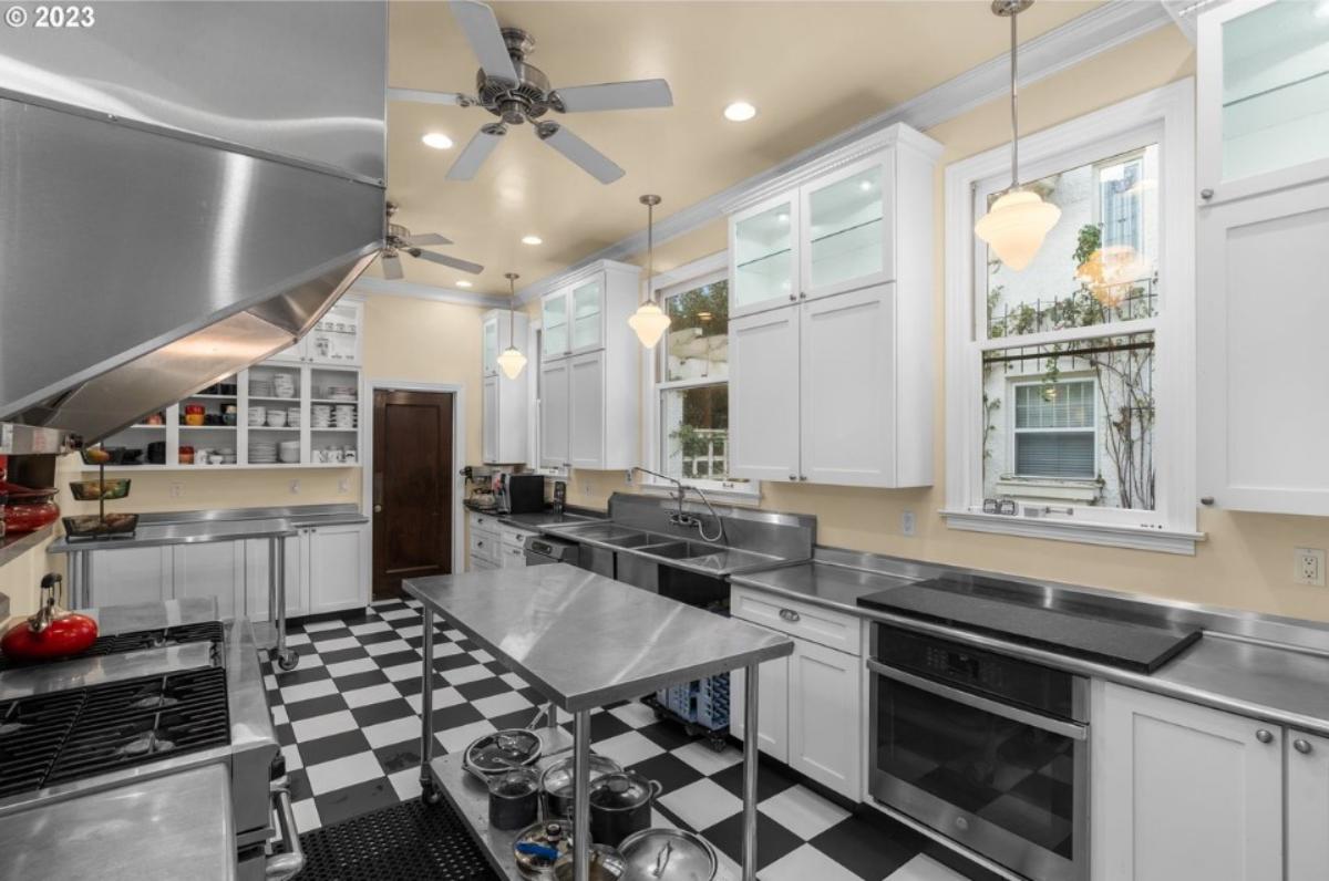 Kitchen with custom lights and custom cabinetry.