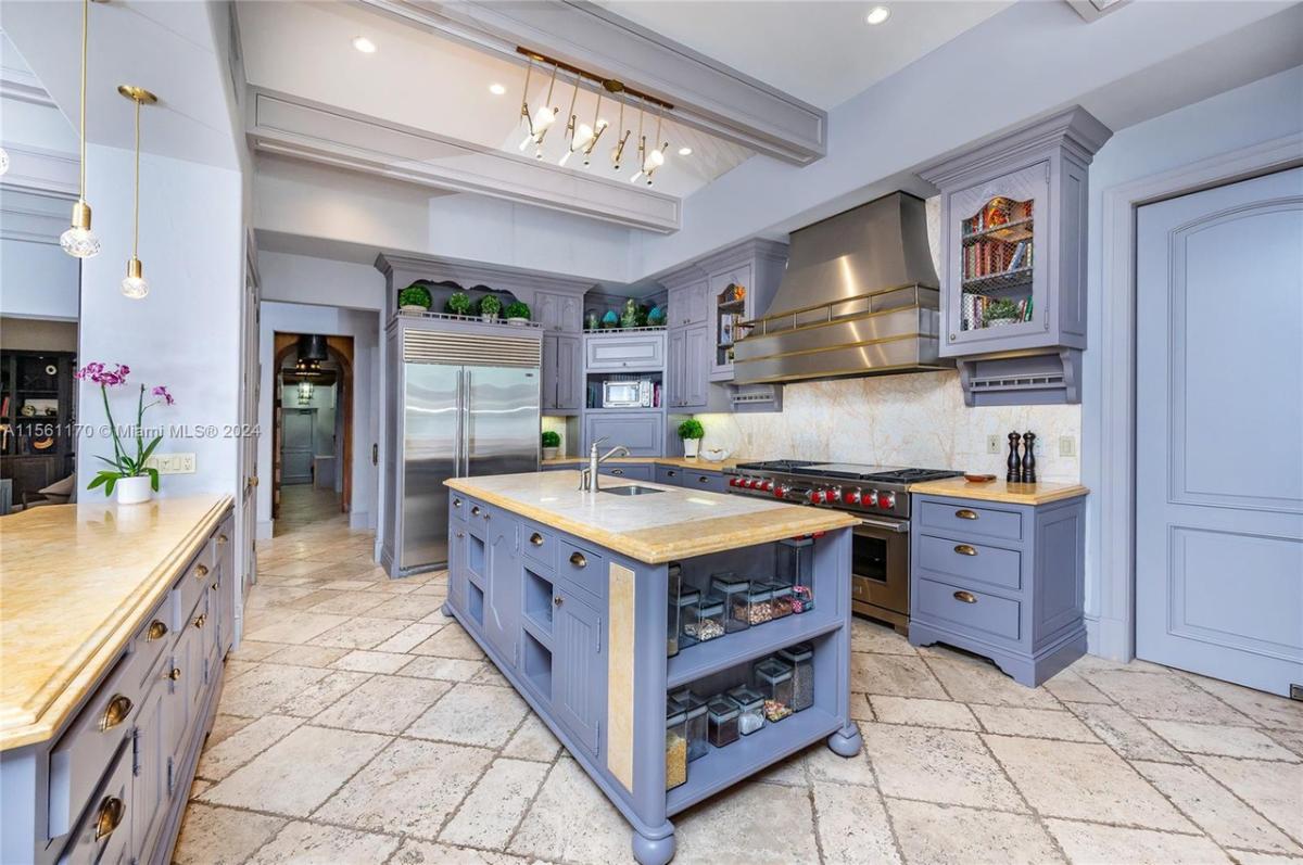 Kitchen with granite countertops and custom cabinetry.