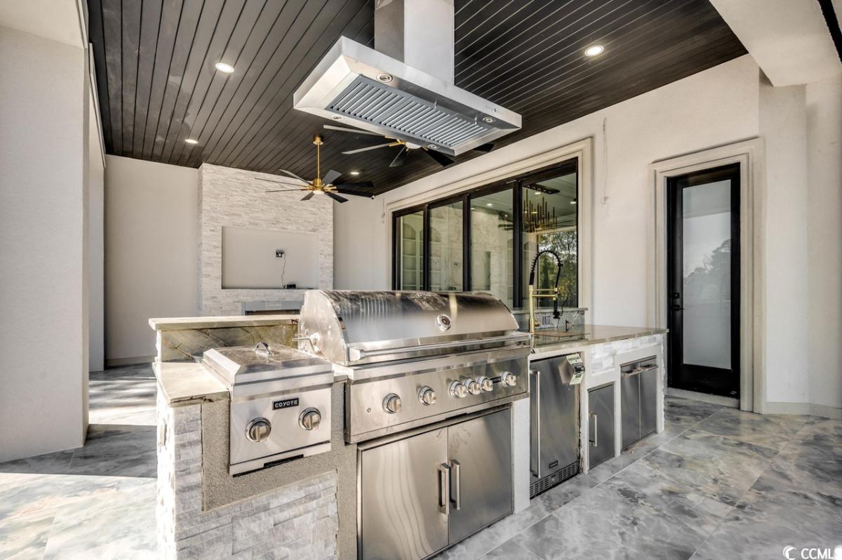Outdoor kitchen with a grill area.