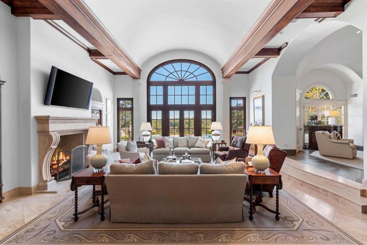 Living room with couches and a fireplace.