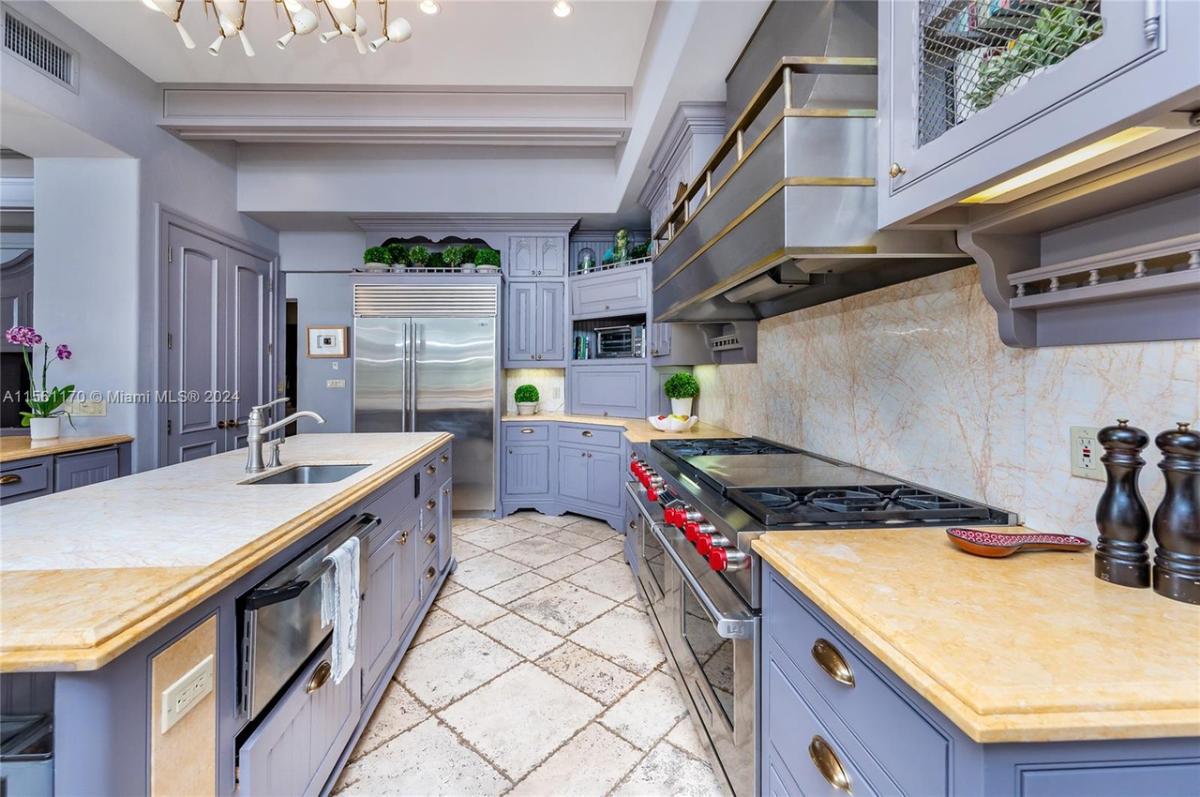 Kitchen with granite countertops and custom cabinetry.