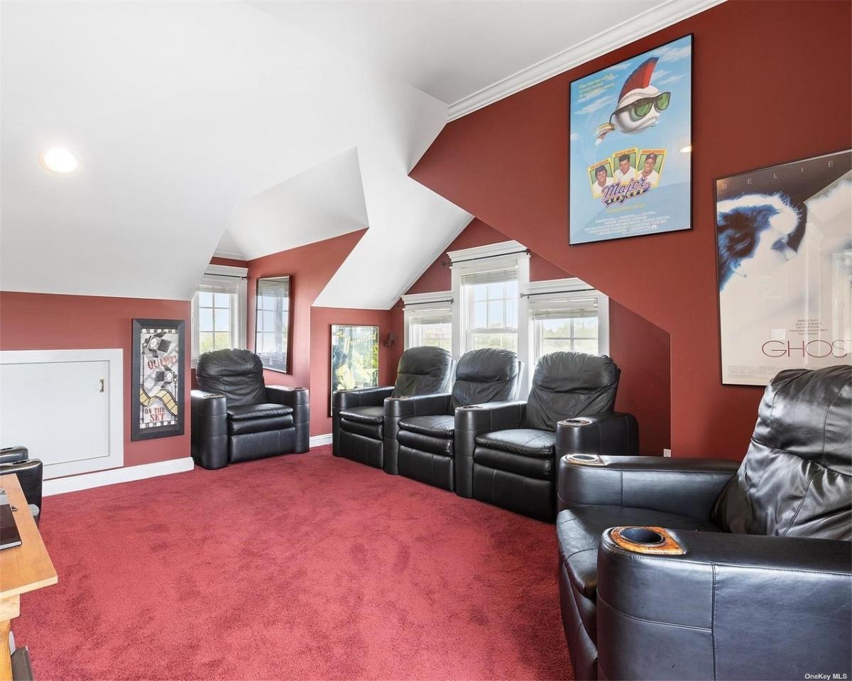 Home theater with carpet flooring.