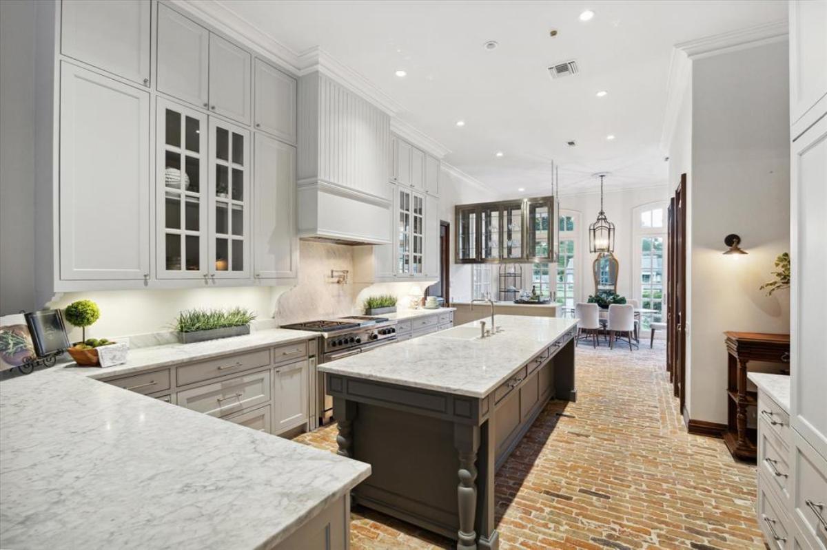 Kitchen with a large island and custom cabinetry.