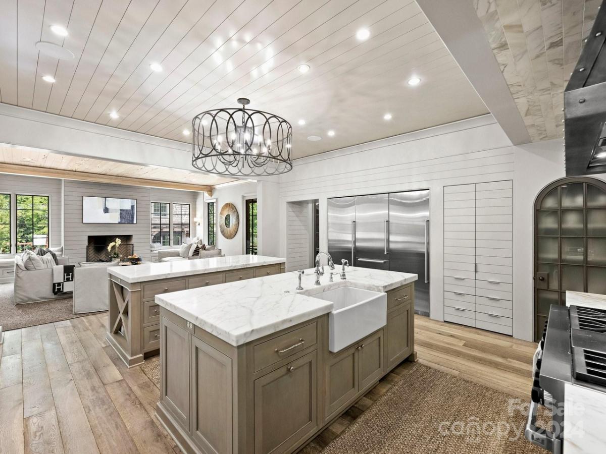 Kitchen with large islands, stainless-steel appliances and custom cabinetry.