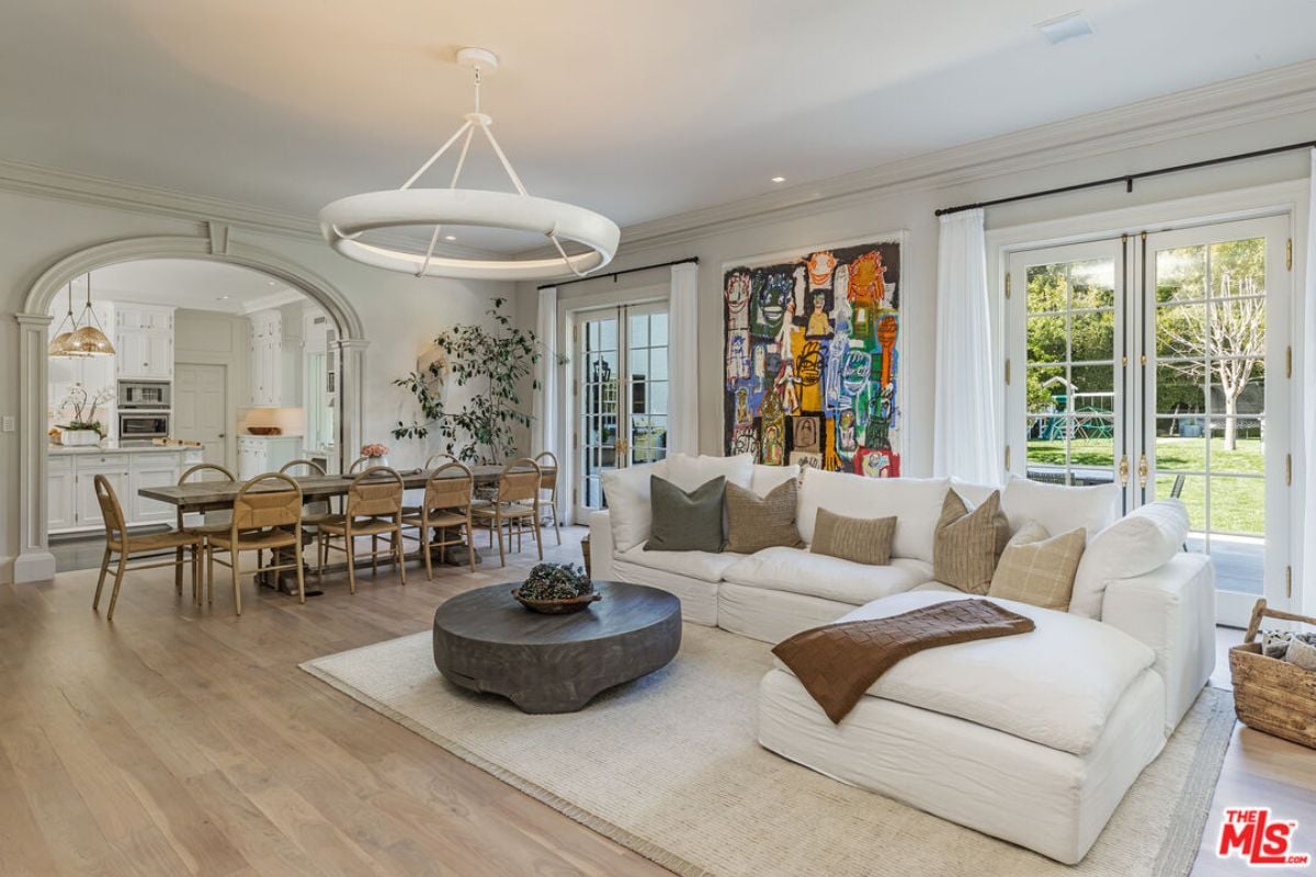 A great room with living space, dining area, and kitchen.
