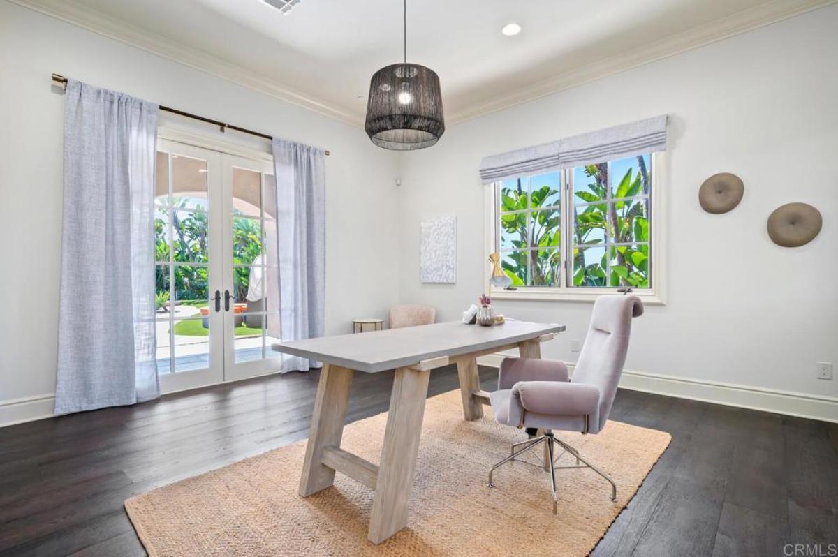 Home office with hardwood floors and French doors.