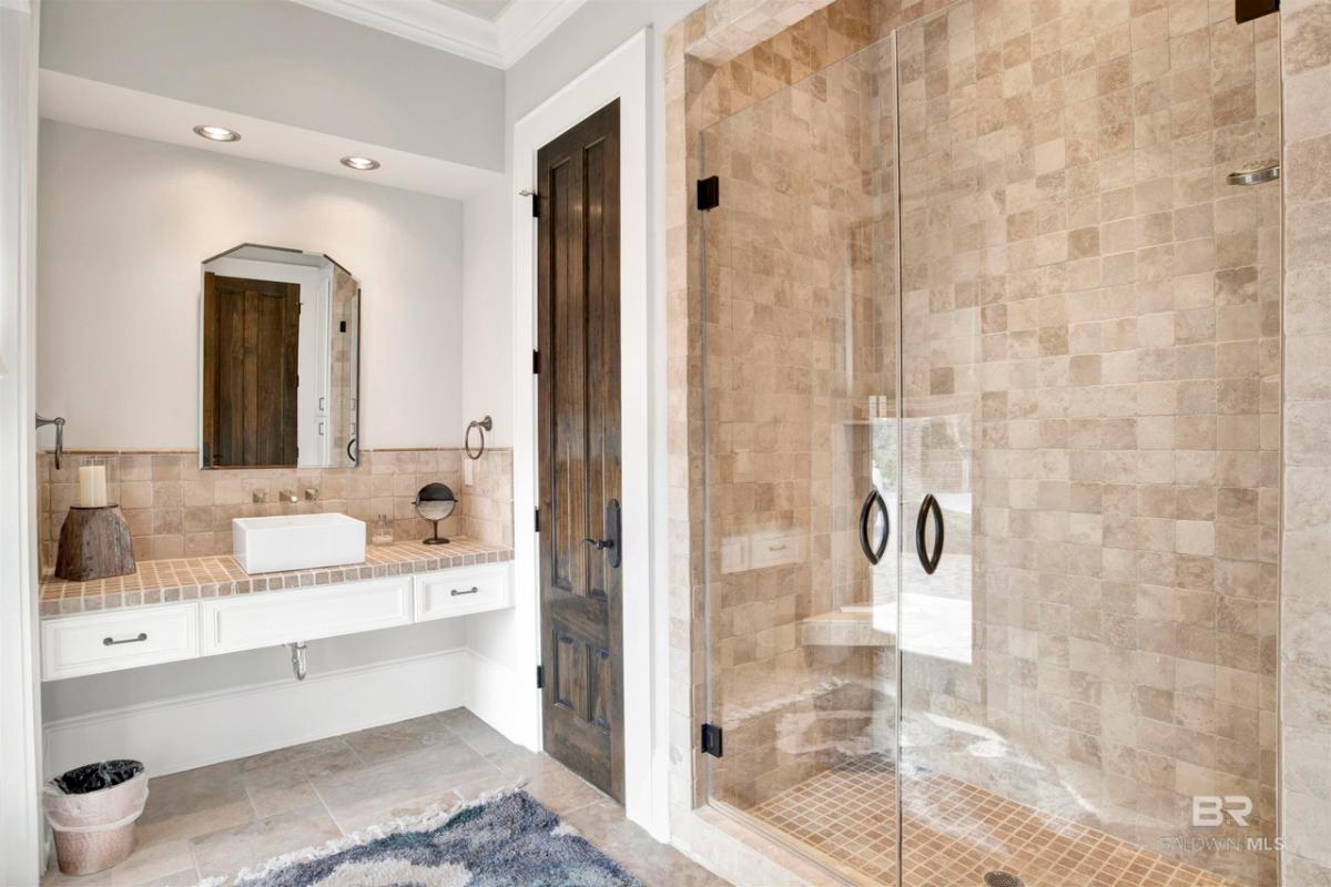 Bathroom with a sink and a walk-in shower.