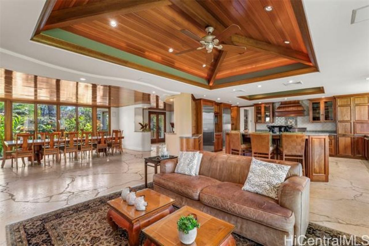 A great room with living space, dining area, and kitchen.