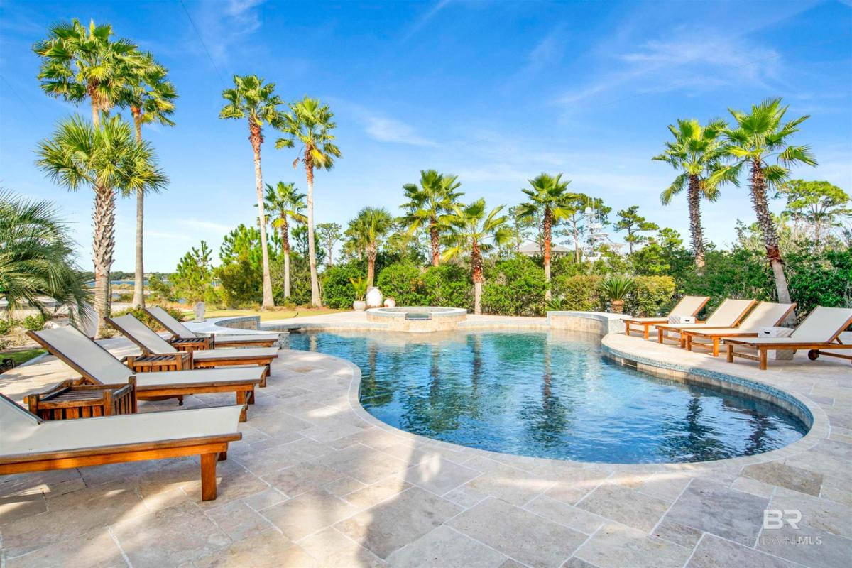 Pool with lounge chairs.