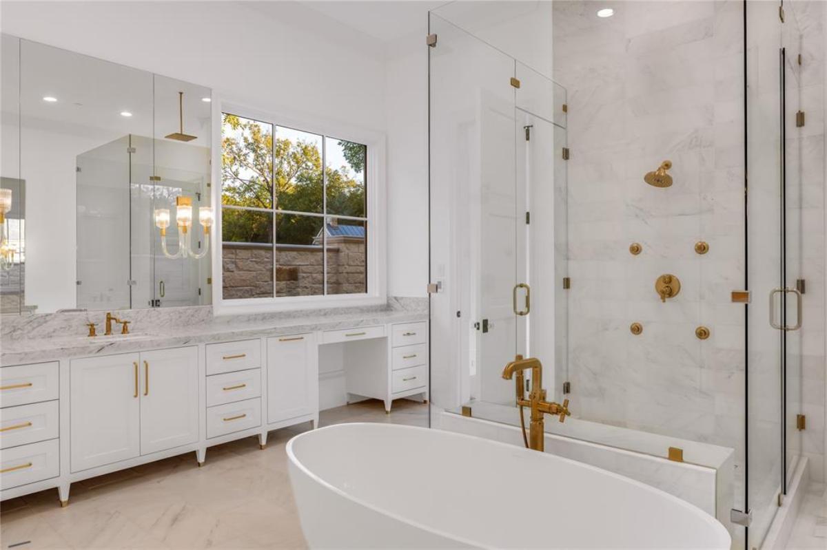 Bathroom with a sink, soaking tub and a walk-in shower.