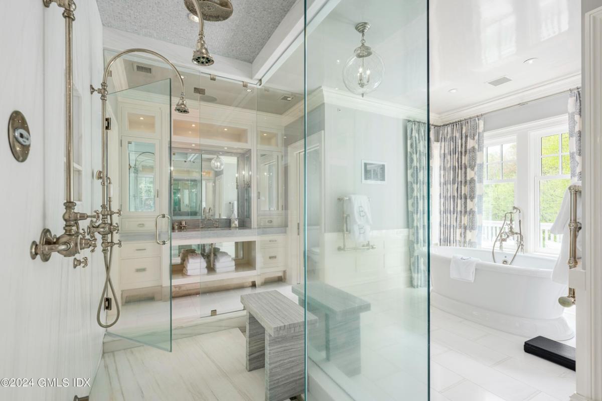 Bathroom with a sink, soaking tub and a walk-in shower.