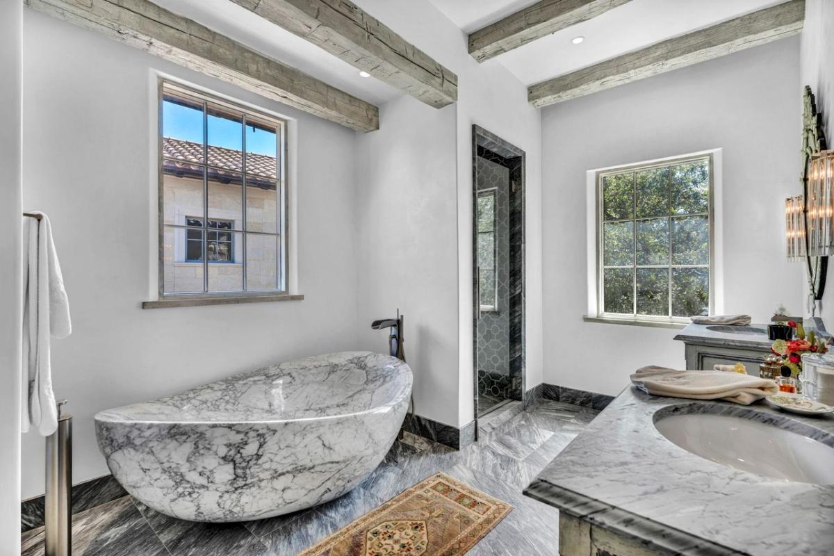 Bathroom with a sink, soaking tub and a walk-in shower.