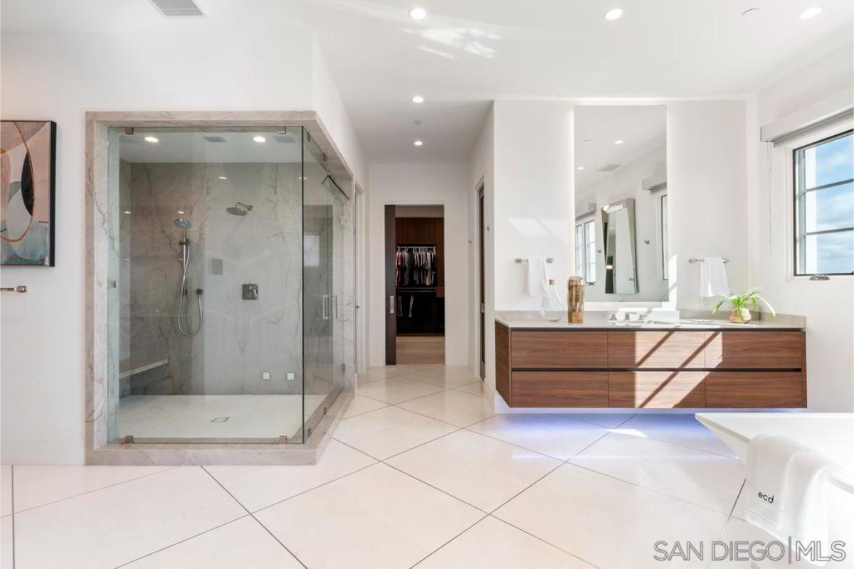 Bathroom with a sink and a walk-in shower.