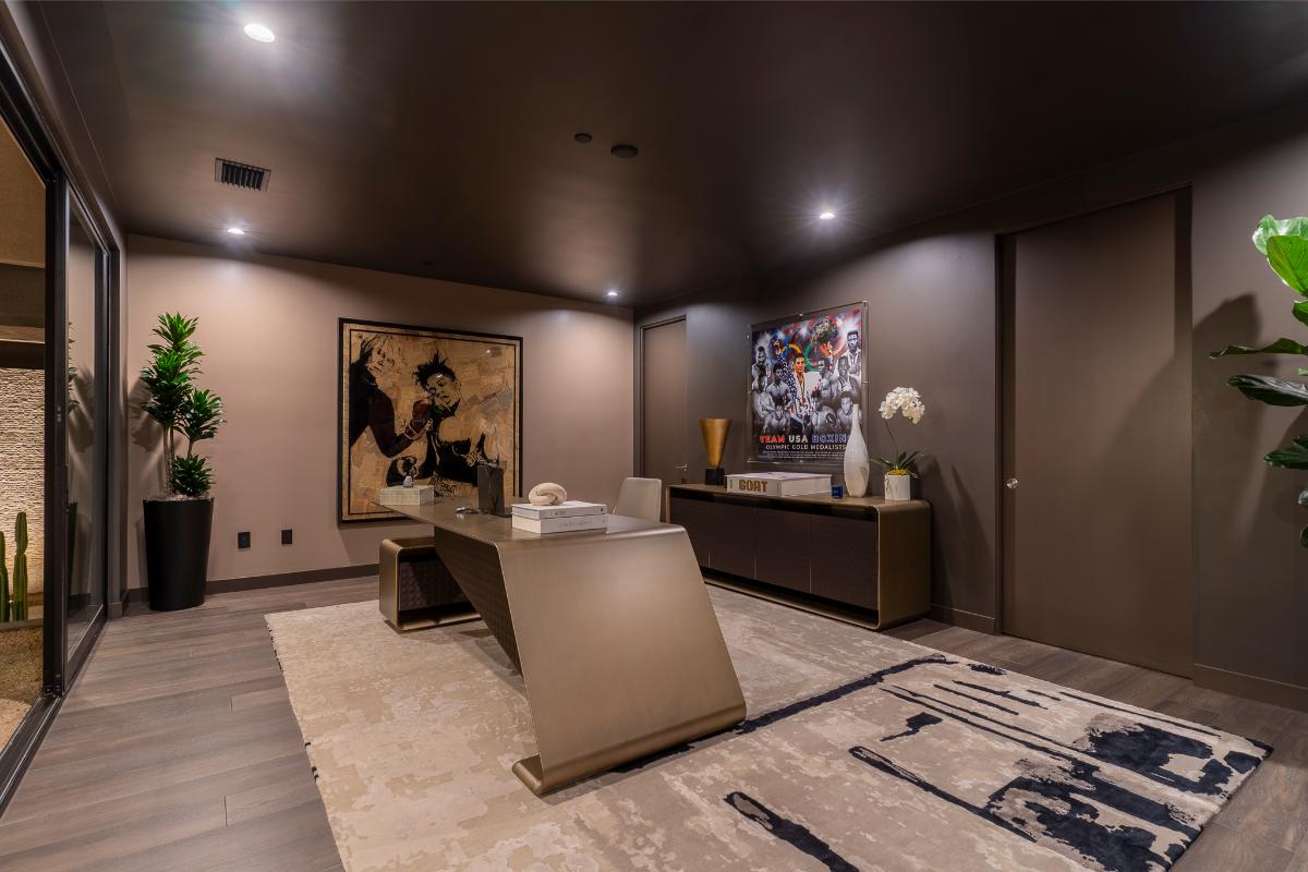Home office with hardwood floors.