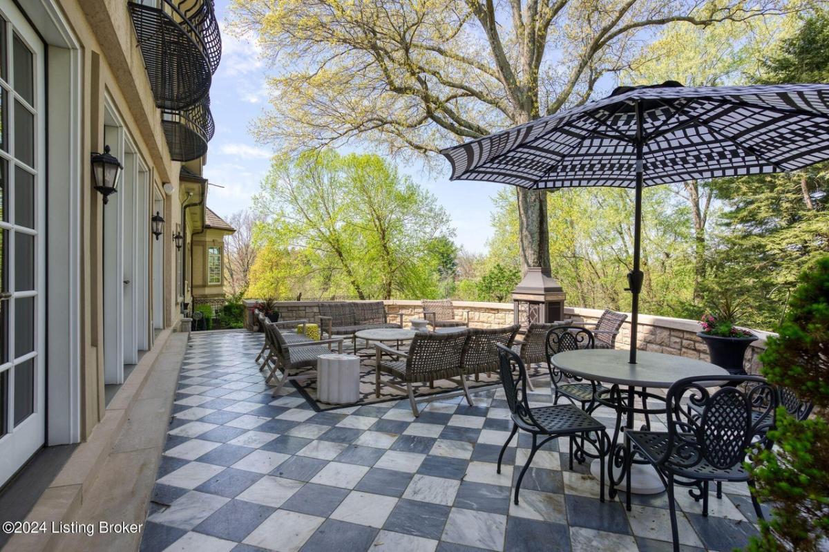 Balcony with tables and chairs.