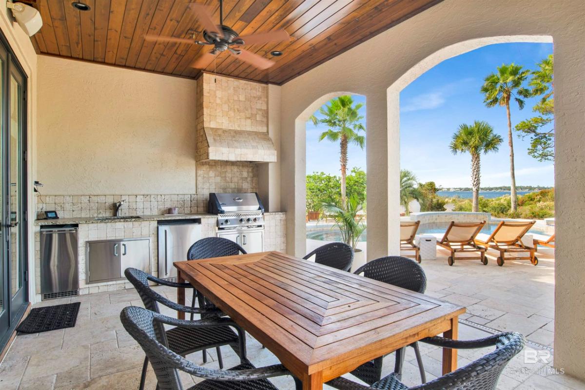Outdoor dining space with grill area.