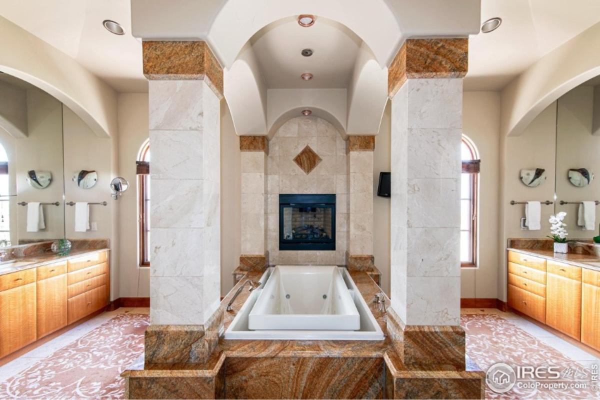 Bathroom with a sink and a soaking tub.