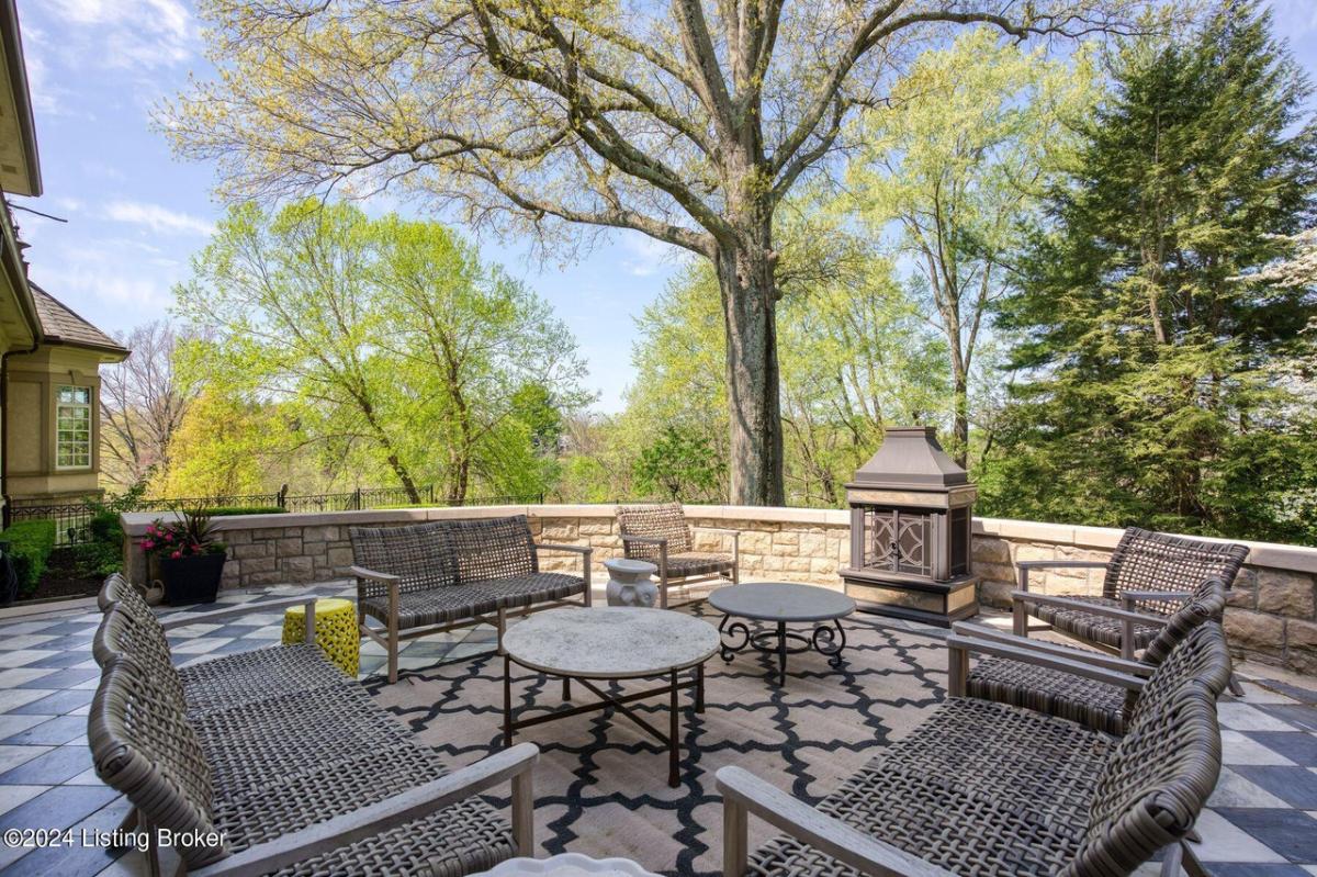 Balcony with tables and chairs.