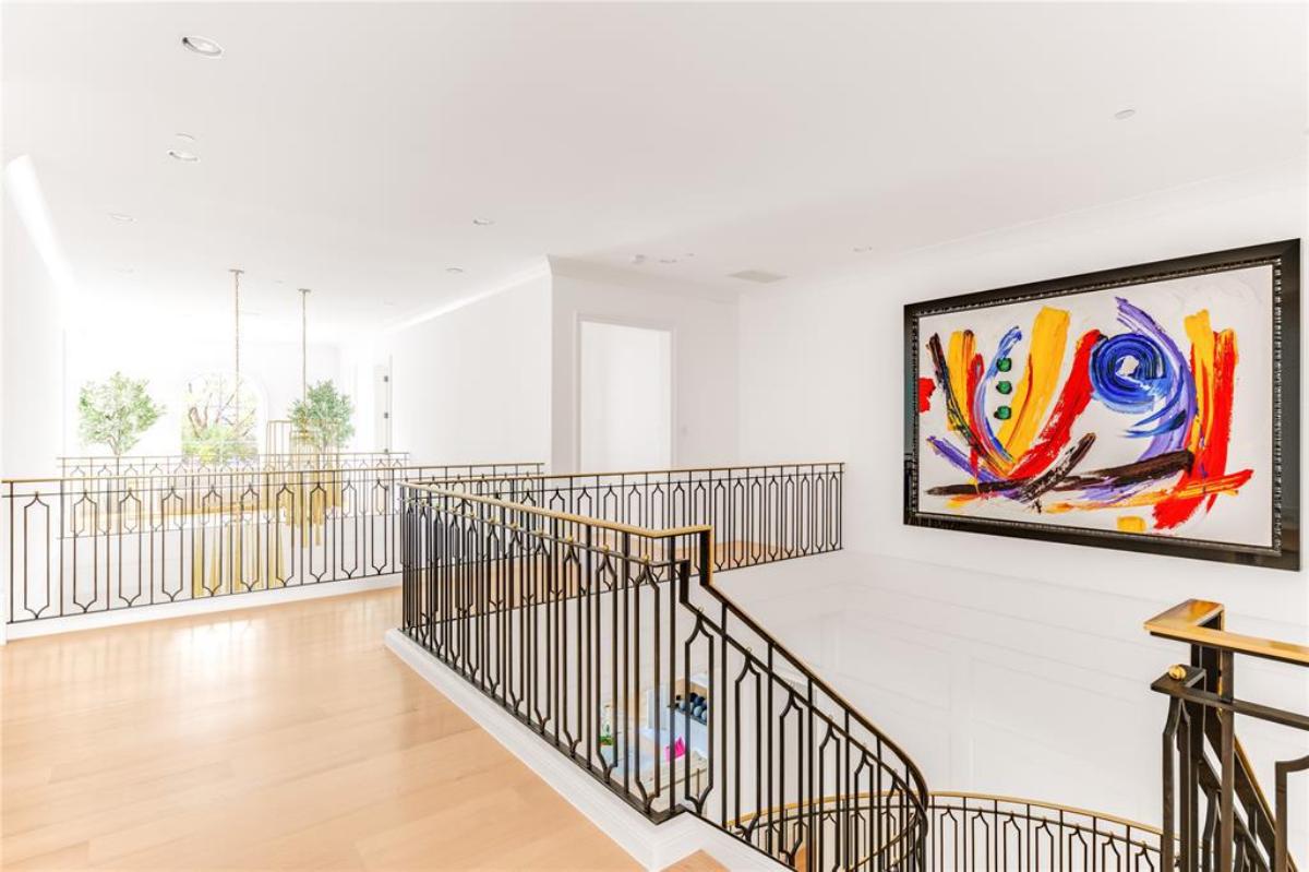 Landing with a large painting on the wall.