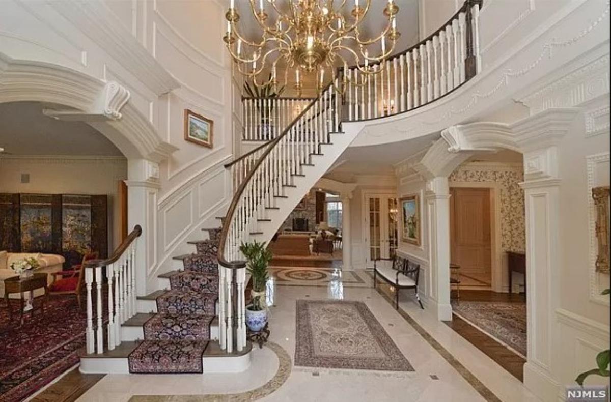 Staircase with a chandelier.
