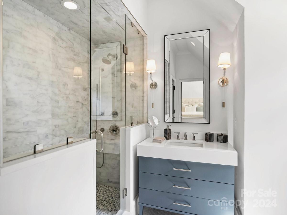 Bathroom with a sink and a walk-in shower.