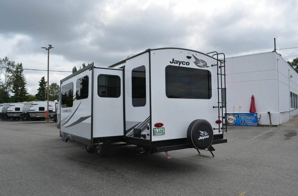 Rear-right view of the 2023 Jayco White Hawk 29RL Travel Trailer RV.