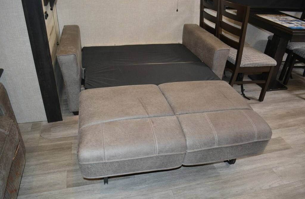 Living area with a convertible sofa bed.