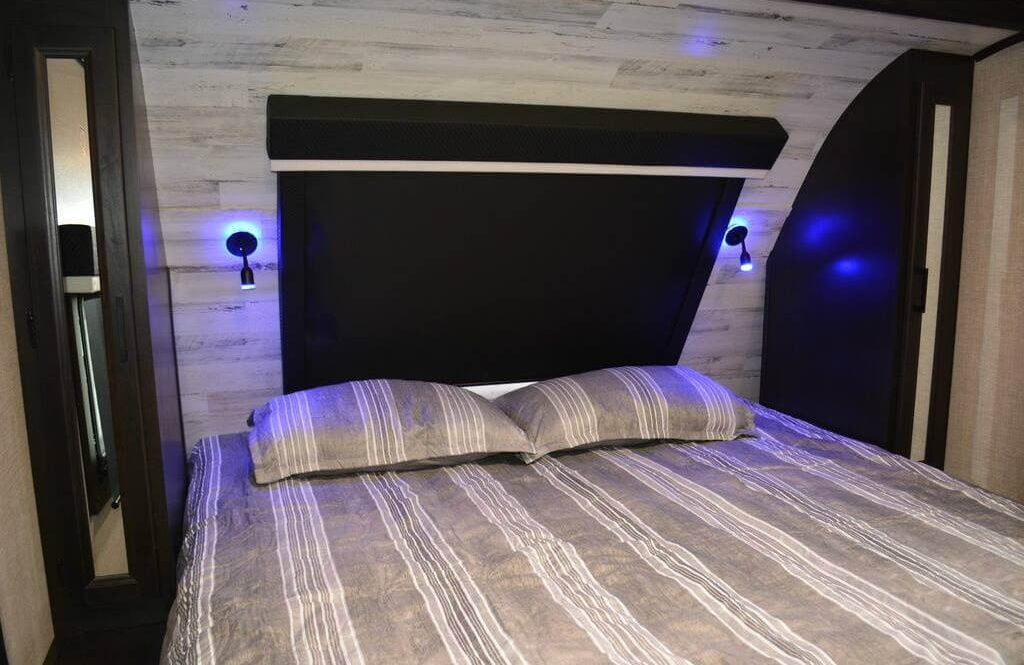 Bedroom with a Murphy bed against knee walls.
